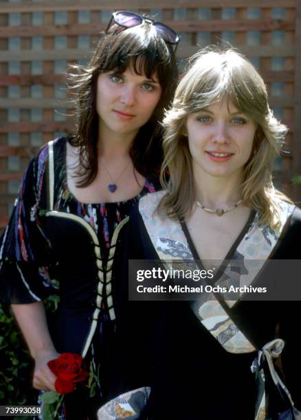 Sisters and musicians Ann Wilson and Nancy Wilson of the rock band "Heart" pose for a portrait session in September 1976 in Los Angeles, California.