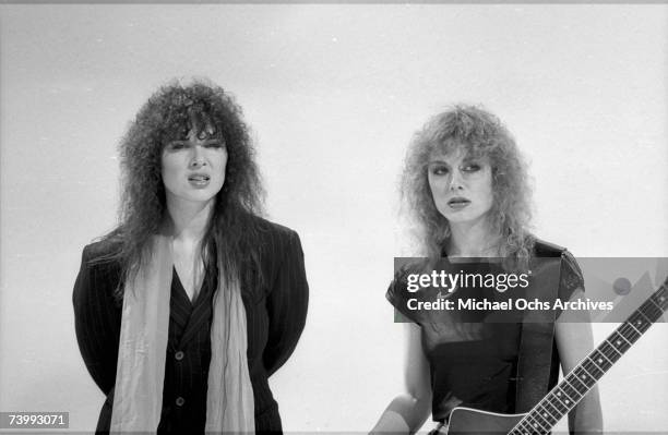 Ann Wilson and Nancy Wilson of the rock and roll band 'Heart' in a film still from a music video in circa 1982 in Los Angeles, California.
