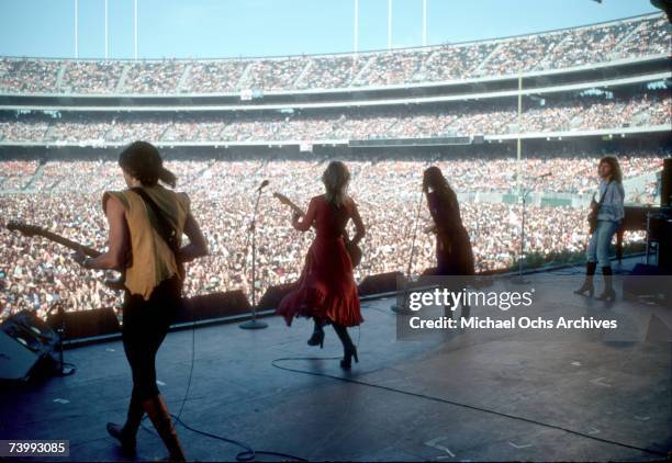 Roger Fisher, Nancy Wilson, Ann Wilson and Howard Leese of the rock band "Heart" perform onstage at the Oakland Coliseum on May 30, 1977 in Oakland,...