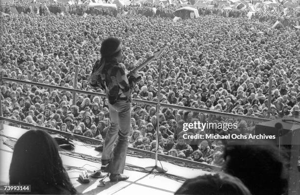 Rock guitarist Jimi Hendrix performs onstage with his Fender Stratocaster electric guitar at his last concert on September 6, 1970 in Isle of...
