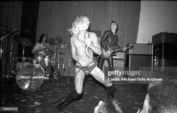 Drummer, Scott Asheton, singer, Iggy Pop and guitarist, James Williamson perform onstage at the Whisky A Go Go on October 30, 1973 in Los Angeles,...