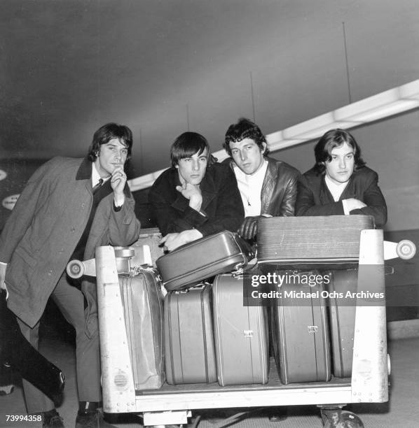 Mick Avory, Dave Davies, Peter Quaife, Ray Davies of the rock group "The Kinks" pose for a picture in the airport on their way to their first US tour...