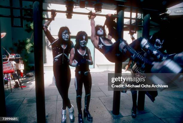 Gene Simmons, Ace Frehley, Paul Stanley and Peter Criss of the rock and roll band "Kiss" joke around with fans and cause mayhem at Grauman's Chinese...