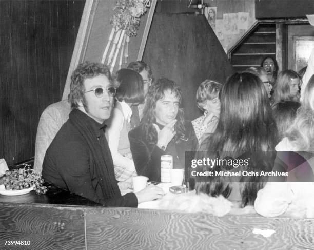 Drinking buddies known as 'The Hollywood Vampires' (L-R - John Lennon , Harry Nilsson and Alice Cooper celebrate an early Thanksgiving watching...