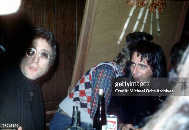 Drinking buddies known as 'The Hollywood Vampires' (L-R - John Lennon , Harry Nilsson and Alice Cooper celebrate an early Thanksgiving watching...