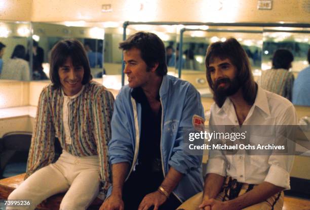 Rcok pop duo "Loggins & Messina" consisting of Kenny Loggins and Jim Messina chat backstage with television host Dick Clark in circa 1974.