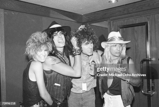 Inglewood, CA Singer Vince Neil and drummer Tommy Lee of the Heavy Metal Band Motley Crue poses backstage at a Quiet Riot concert at the Forum on...