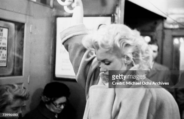 Actress Marilyn Monroe takes the subway in Grand Central Station on March 24, 1955 in New York City, New York.