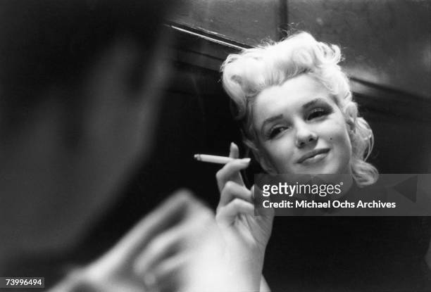 Actress Marilyn Monroe relaxes in a quiet moment in a restaurant in March 1955 in New York City, New York.