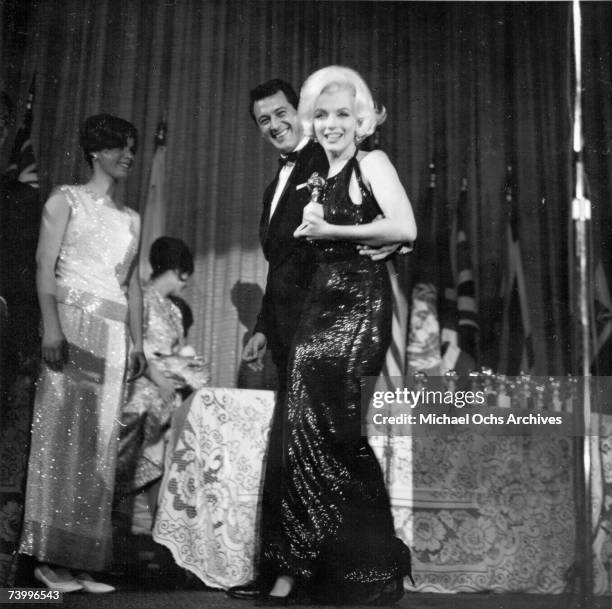 Actress Marilyn Monroe attends the Golden Globe Awards where she won the "Henrietta" award at the Beverly Hilton Hotel on March 5, 1962 in Los...