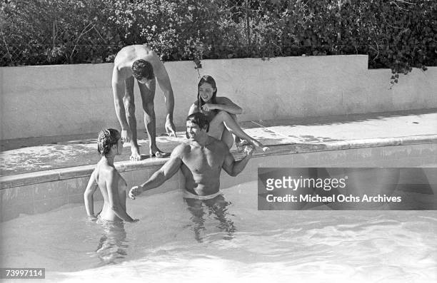 Actor and bodybuilder Arnold Schwarzenegger and actress Nastassja Kinski with actor Johnny Crawford and Debra Tate, sister of the late actress,...