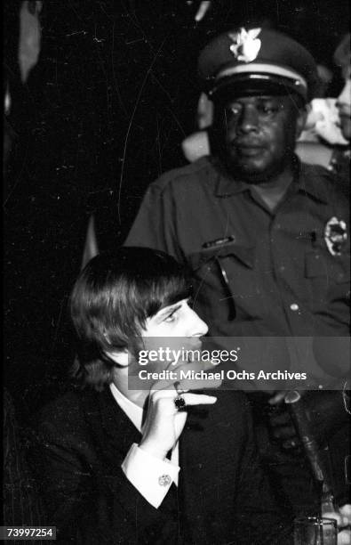 Drummer Ringo Starr of the rock and roll band "The Beatles" answers questions at a press conference at the Cinnamon Cinder youth nightclub on August...