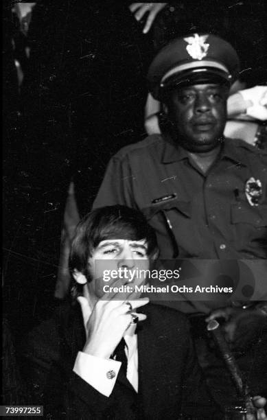 Drummer Ringo Starr of the rock and roll band "The Beatles" answers questions at a press conference at the Cinnamon Cinder youth nightclub on August...