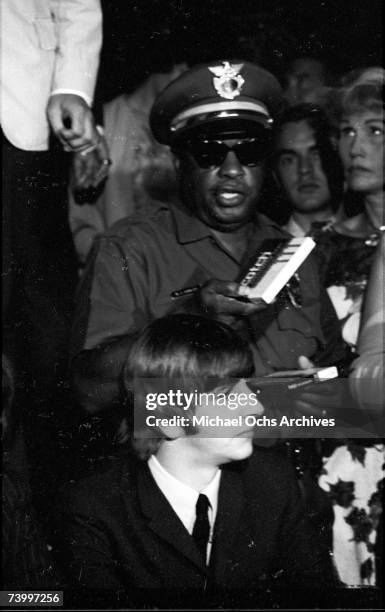 Drummer Ringo Starr of the rock and roll band "The Beatles" answers questions at a press conference at the Cinnamon Cinder youth nightclub on August...