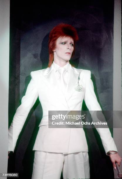 Musician David Bowie wears a white suit in November 1973 in London, England.