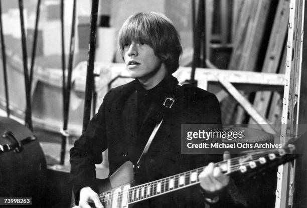 Guitarist Brian Jones of the rock and roll band 'The Rolling Stones' performs onstage in circa 1965.