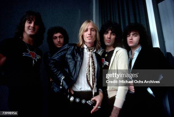 Tom Petty and The Heartbreakers pose for a portrait backstage in August 1977 in Los Angeles, California.