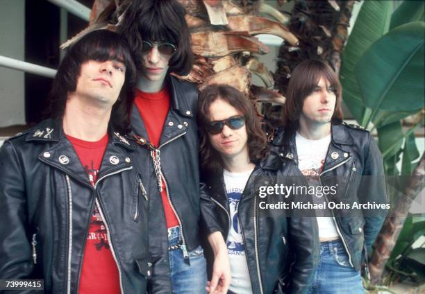 Dee Dee Ramone, Joey Ramone, Tommy Ramone and Johnny Ramone of the rock and roll band "The Ramones" pose for a portrait holding letters that spell...