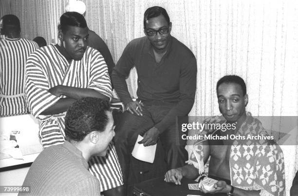 Photo of Smokey Robinson & The Miracles. Bobby Rogers second right.