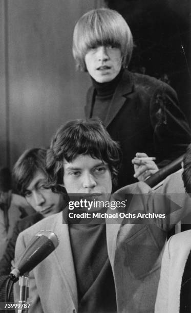 Drummer Charlie Watts, singer Mick Jagger and guitarist Brian Jones of the rock and roll band 'The Rolling Stones' at a press conference at the New...