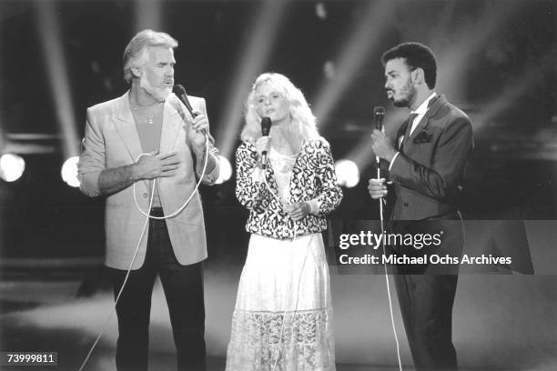 Singers Kenny Rogers, Kim Carnes and James Ingram performing on Solid Gold in September 1984 in Los Angeles.
