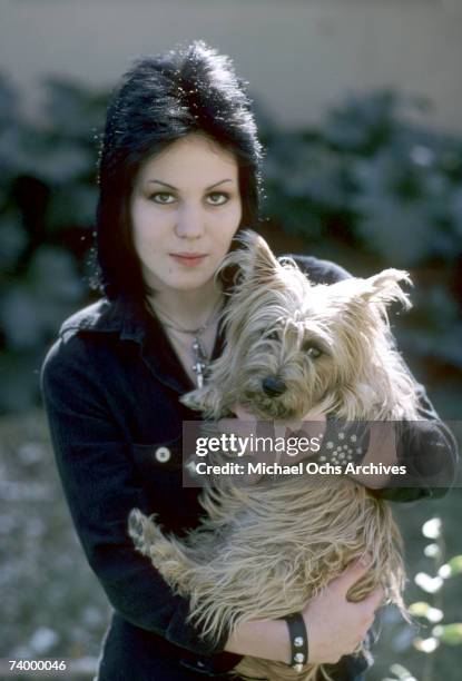 Guitarist Joan Jett of the rock band "The Runaways" poses for a portrait withe her dog "Meg" by her family´s home in Canoga Park just outside Los...