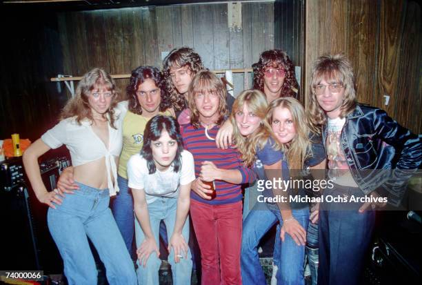 Rock band "The Runaways" pose for a portrait with musician Rick Derringer and radio DJ Rodney Bingenheimer in September of 1976 in Los Angeles.