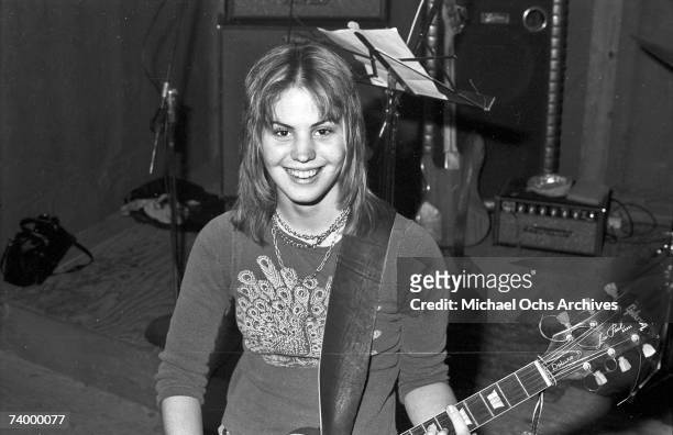 Joan Jett of the rock band "The Runaways" poses for a portrait with her guitar in Los Angeles in 1975.