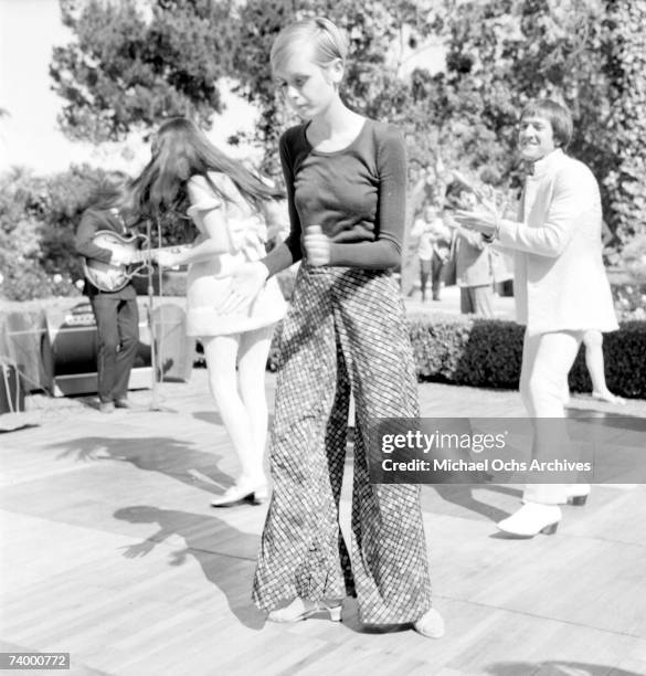 Twiggy is the guest of honor at a party held at the house of Sonny and Cher, L-R: Cher, Twiggy and Sonny Bono on May 15, 1967 in Beverly Hills,...