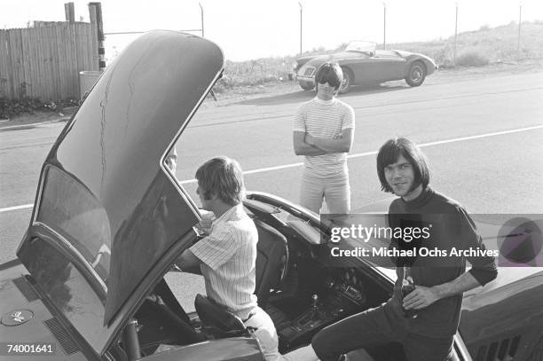 Members of the rock group 'Buffalo Springfield' take the top off of their Corvette on October 30, 1967 in Malibu, California. Dewey Martin, Richie...