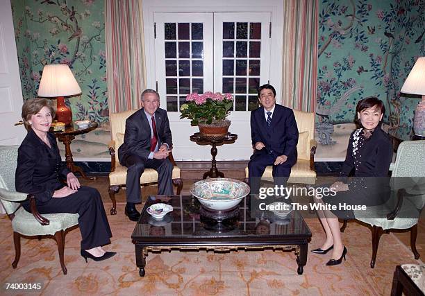 In this handout photo provided by The White House, President George W. Bush and Mrs. Laura Bush meet with Japanese Prime Minister Shinzo Abe and his...