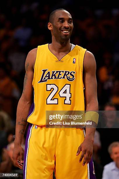 Kobe Bryant of the Los Angeles Lakers smiles after the Lakers defeated the Phoenix Suns in Game Three of the Western Conference Quarterfinals during...