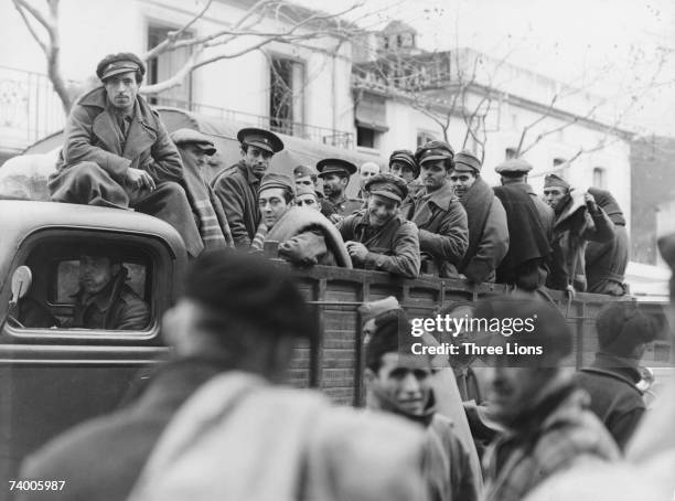 Truckload of Loyalist soldiers are transported to a prisoner-of-war camp during the Spanish Civil War, circa 1937.
