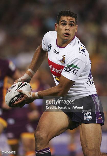 Greg Inglis of the Storm in attack during the round seven NRL match between the Brisbane Broncos and the Melbourne Storm at Suncorp Stadium on April...