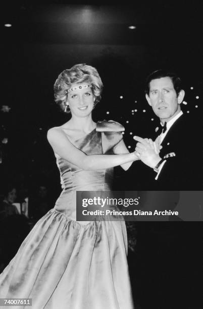 Prince Charles and Princess Diana dancing at an official function in Melbourne during tour of Australia, 1st October 1985. Diana is wearing a diamond...