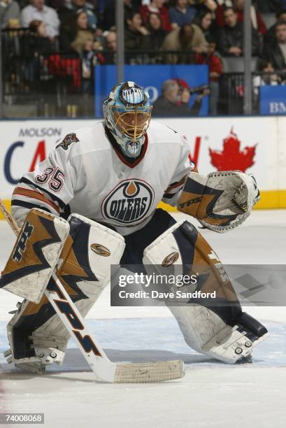 Dwayne Roloson of the Edmonton Oilers eyes the play against the Toronto Maple Leafs at Air Canada Centre on February 17, 2007 in Toronto, Ontario,...