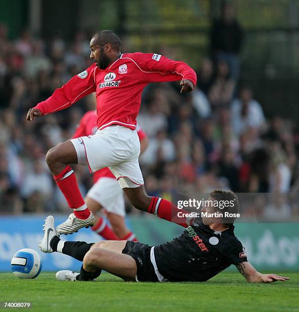 Marvin Braun of St.Pauli tries to stop Musemestre Bamba of Ahlen during the Third League match between FC St.Pauli and RW Ahlen at the Millerntor...