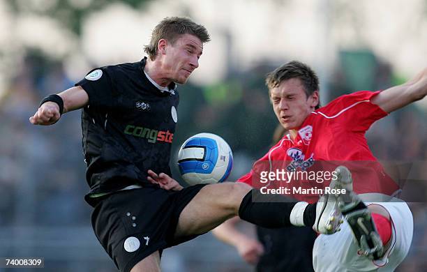 Marvin Braun of St.Pauli and Ole Kittner of Ahlen fight for the ball during the Third League match between FC St.Pauli and RW Ahlen at the Millerntor...