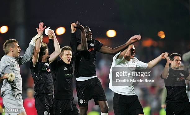 Patrik Borger, Daniel Stndel, Marvin Braun, Morike Sako, Benedikt Pliquett and Thomas Meggle of St.Pauli celebrate with the fans during the Third...