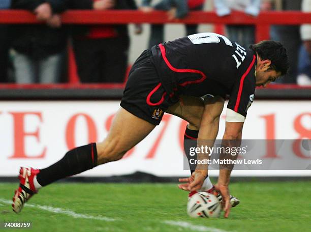 Trent Barrett of Wigan scores a try during the engage Super League match between Salford City Reds and Wigan Warriors at the Willows on April 27,...