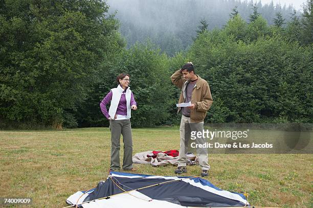 indian couple putting up tent - the comedy tent stock pictures, royalty-free photos & images
