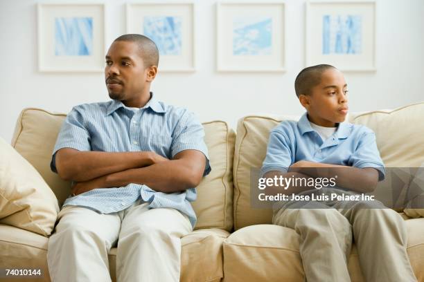 african father and son arguing - tegendraads stockfoto's en -beelden