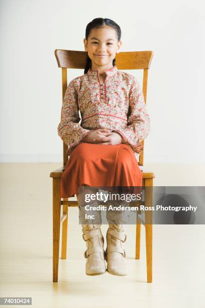 portrait of pacific islander girl sitting in chair - pacific islander girl fotografías e imágenes de stock