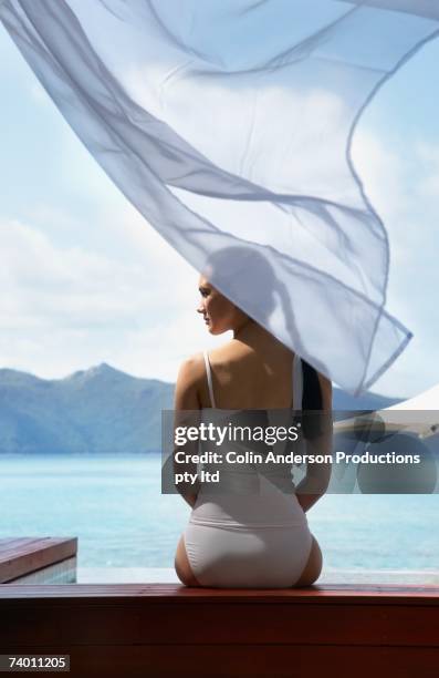 pacific islander woman at beach - curtain blowing stock pictures, royalty-free photos & images