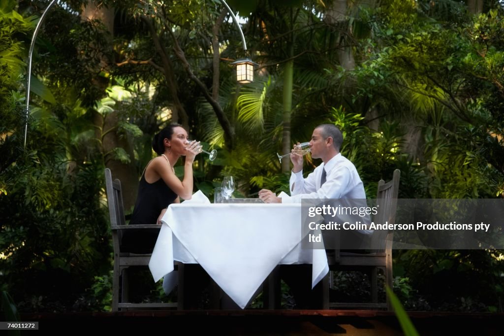 Couple eating at outdoor restaurant