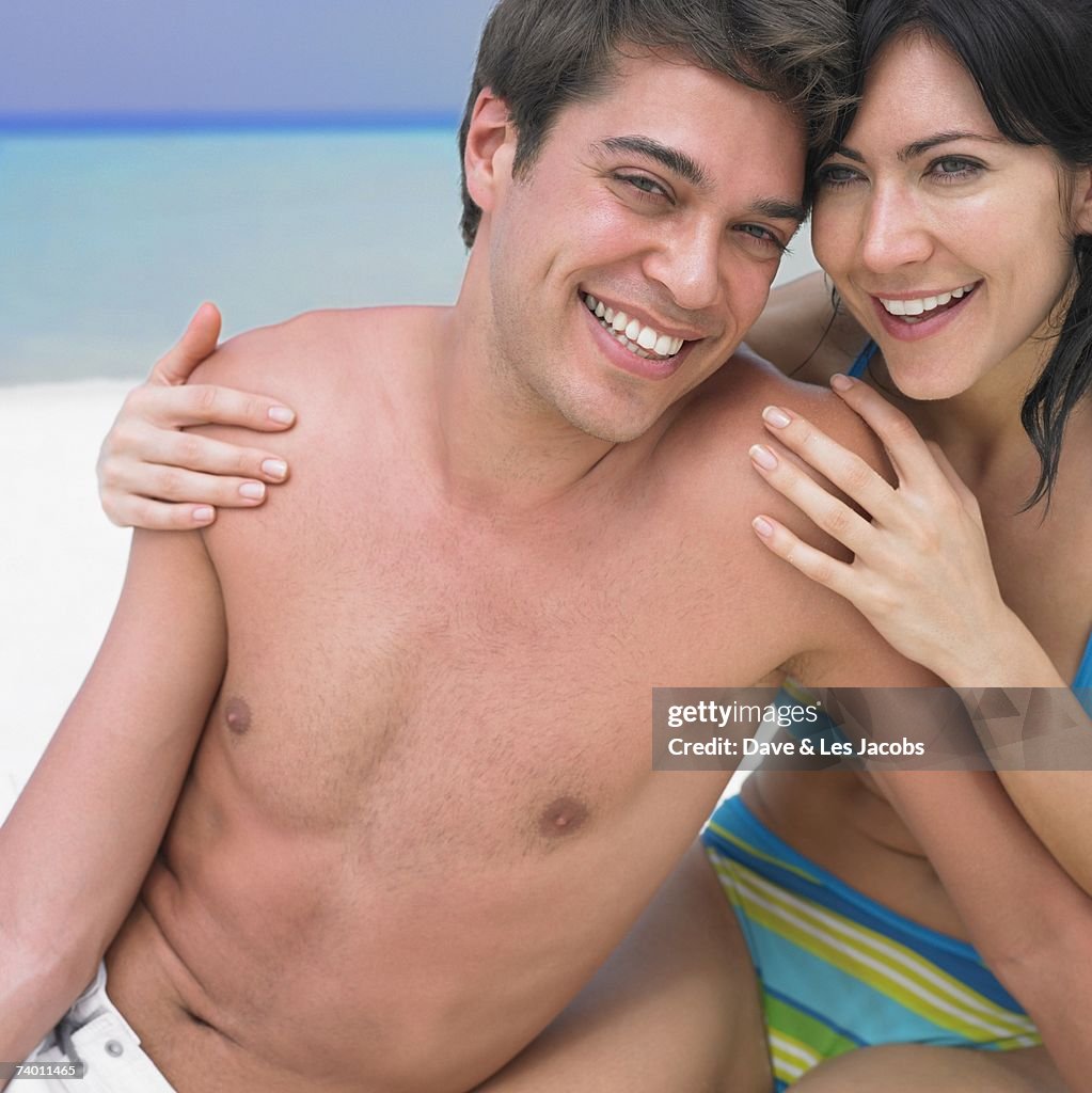 Couple hugging at beach