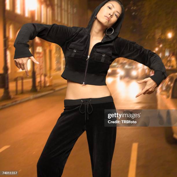 asian woman posing in street - jogging pants stock pictures, royalty-free photos & images