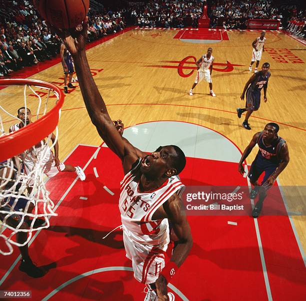 Dikembe Mutombo of the Houston Rockets lays up a shot during a game against the Phoenix Suns at Toyota Center on April 16, 2007 in Houston, Texas....