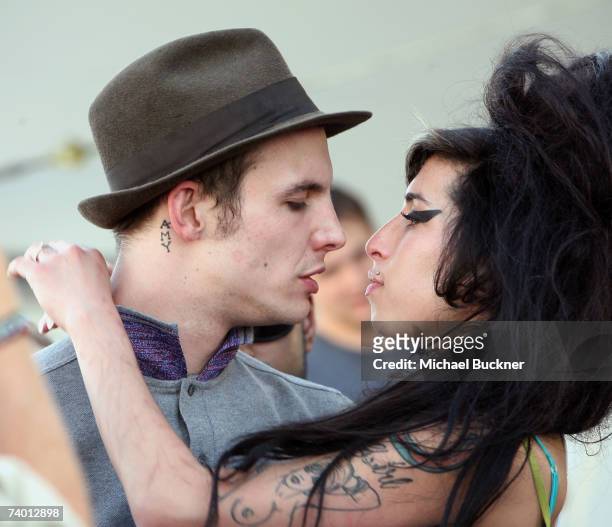Singer Amy Winehouse kisses fiance Blake Fielder-Civil during day 1 of the Coachella Music Festival held at the Empire Polo Field on April 27, 2007...