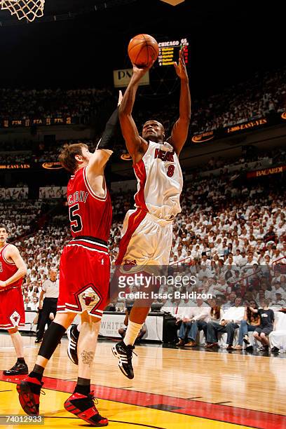 Antoine Walker of the Miami Heat shoots against Andres Nocioni of the Chicago Bulls in Game Three of the Eastern Conference Quarterfinals during the...